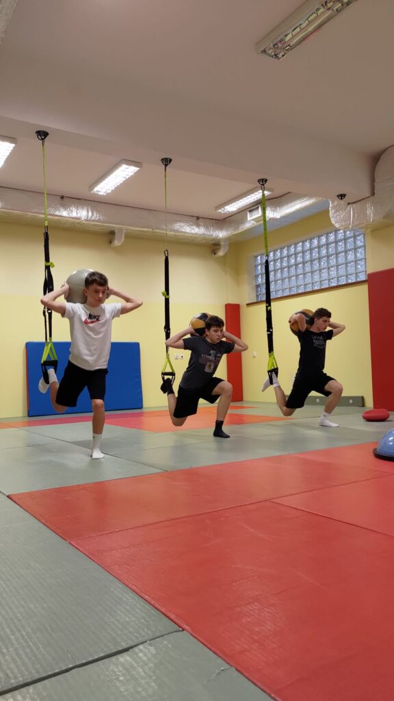 May be an image of 3 people and people performing martial arts